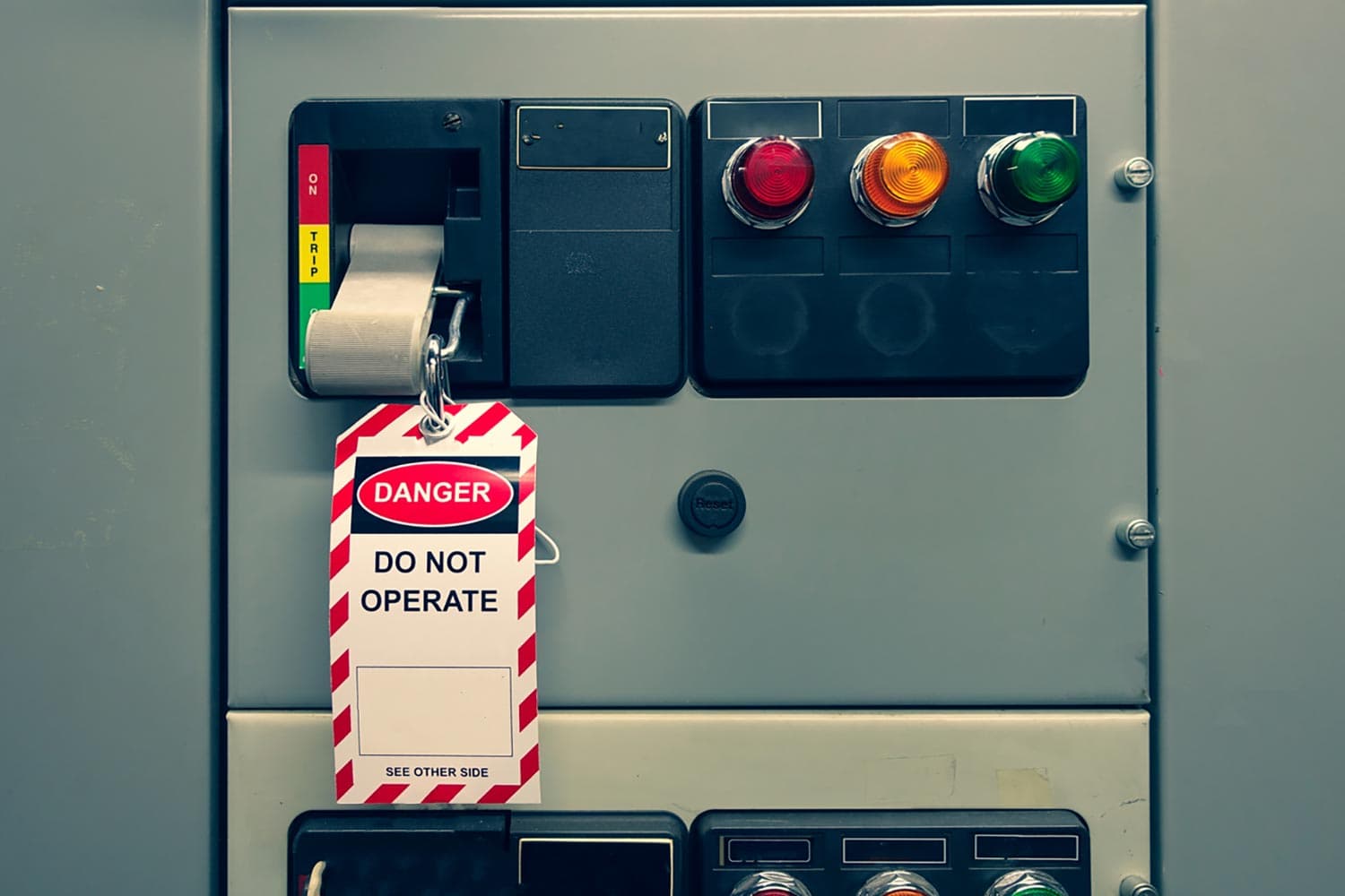 Lockout device and a red Danger Do Not Operate tag on an industrial electrical disconnect switch