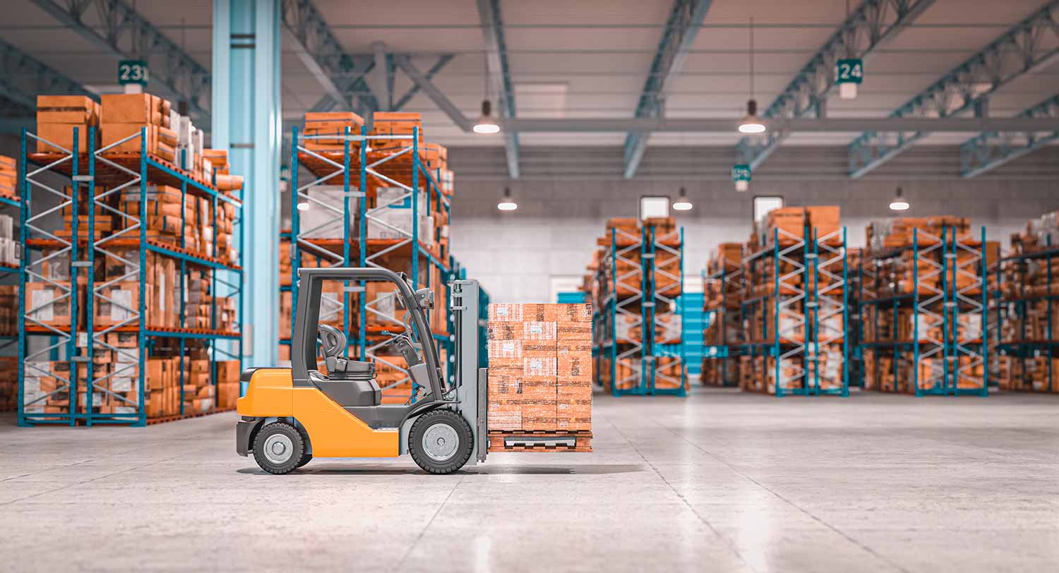 Orange forklift carrying a shrink-wrapped pallet of boxes down a wide aisle between tall warehouse racks