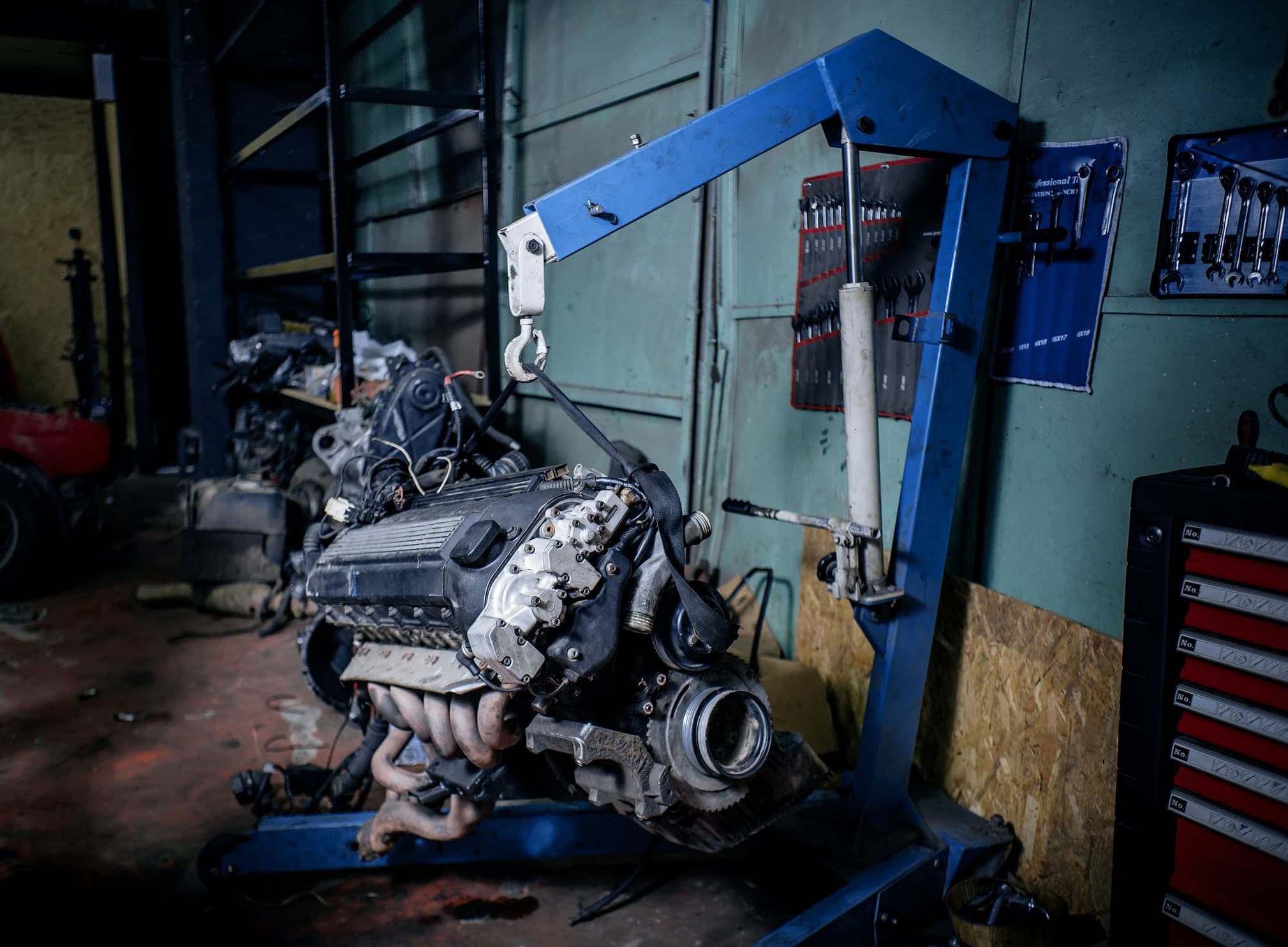 Forklift handling freight inside a heavy duty equipment repair facility