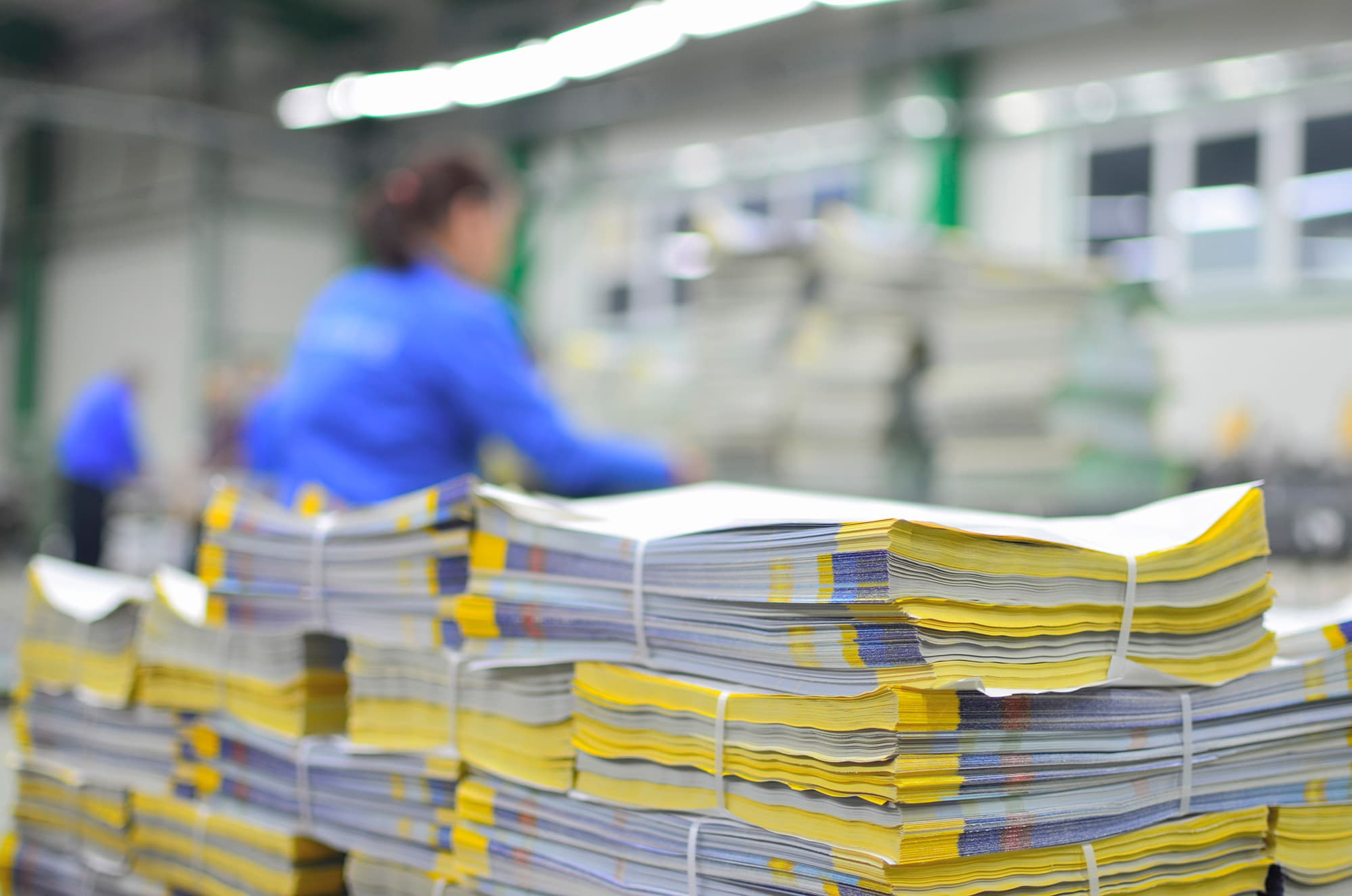 Commercial printer employee follows GMG EnviroSafe's tailored EHS solutions for safety