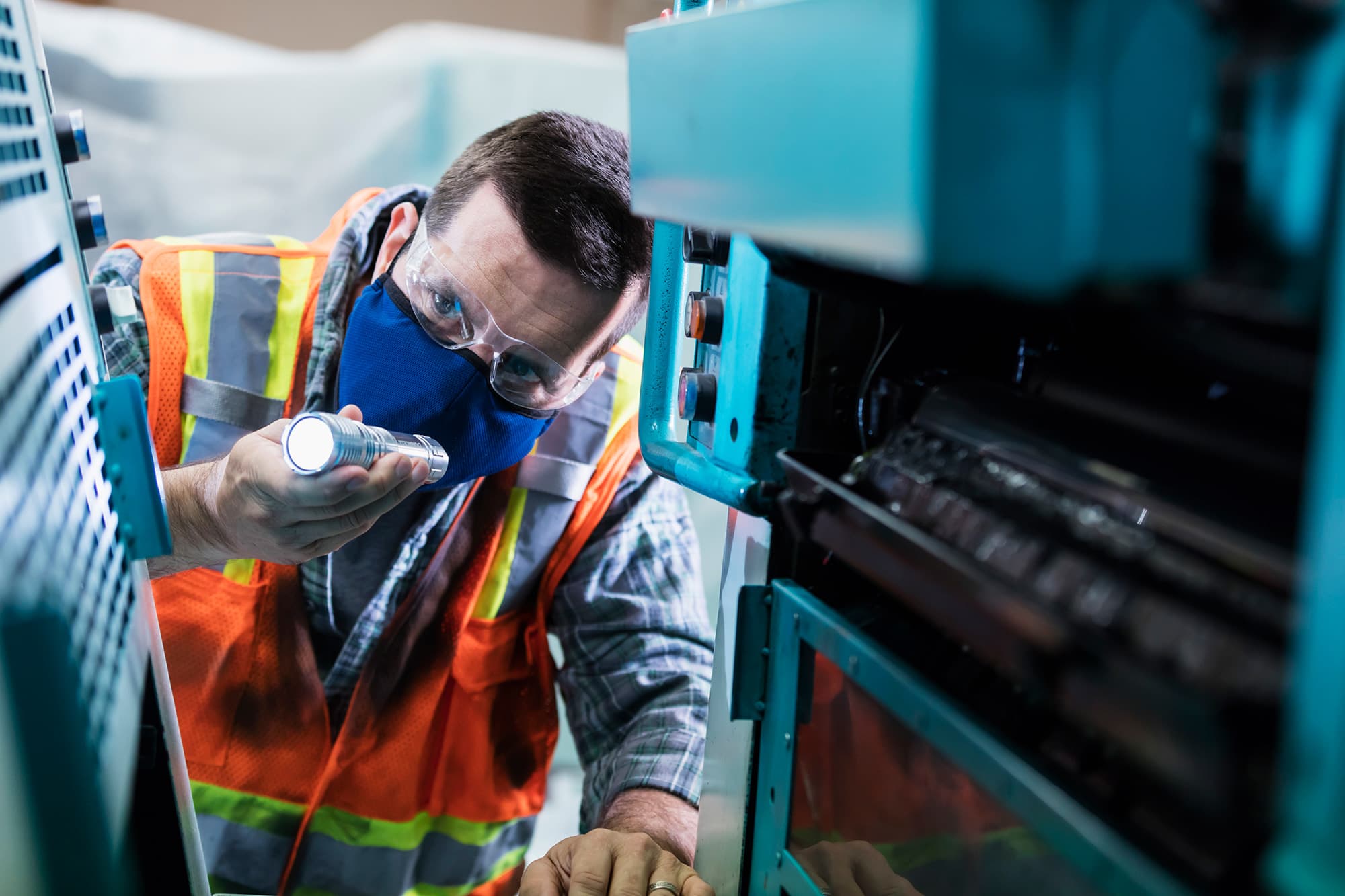 Commercial printer employee follows GMG EnviroSafe's tailored EHS solutions for safety