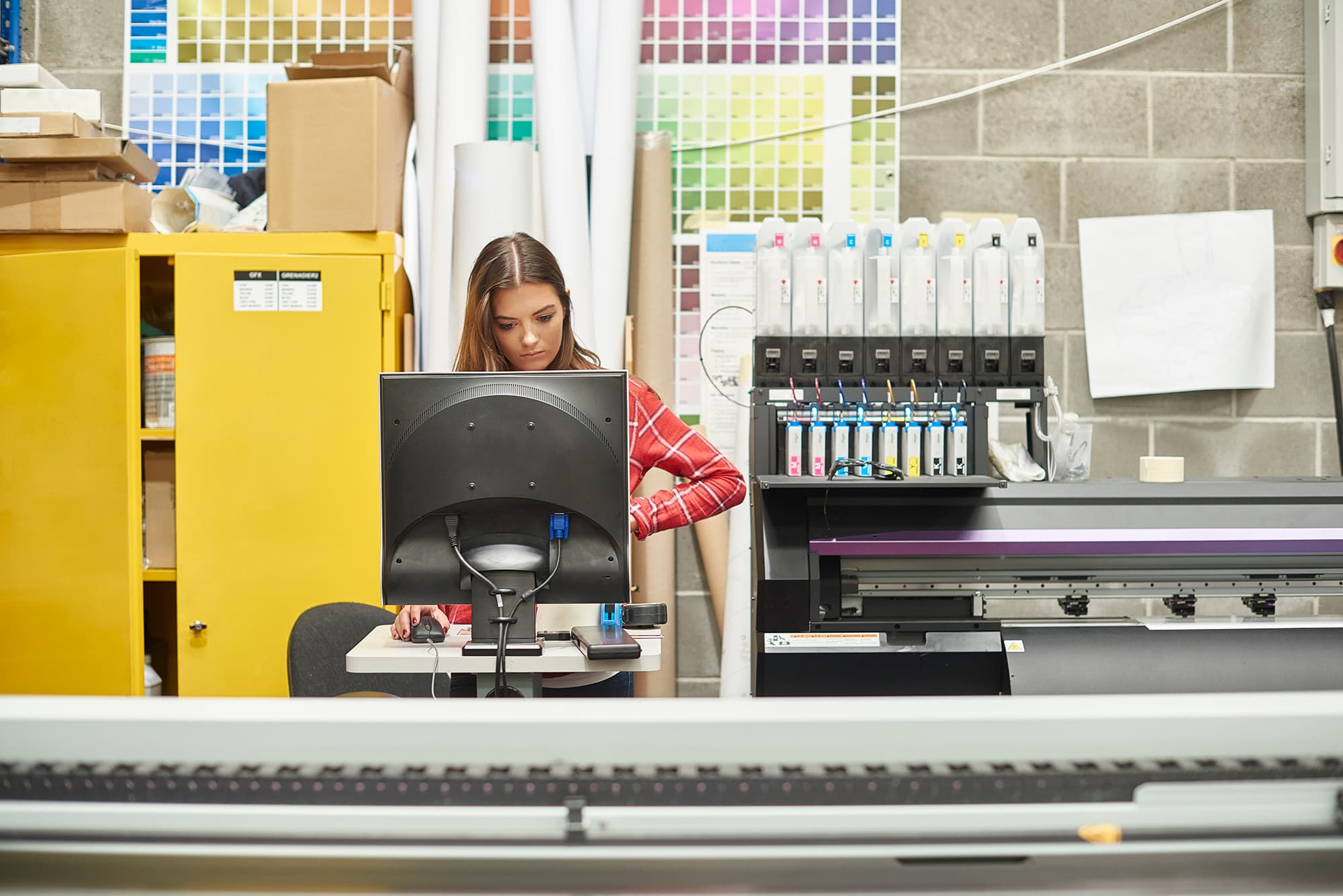 Commercial printer employee follows GMG EnviroSafe's tailored EHS solutions for safety