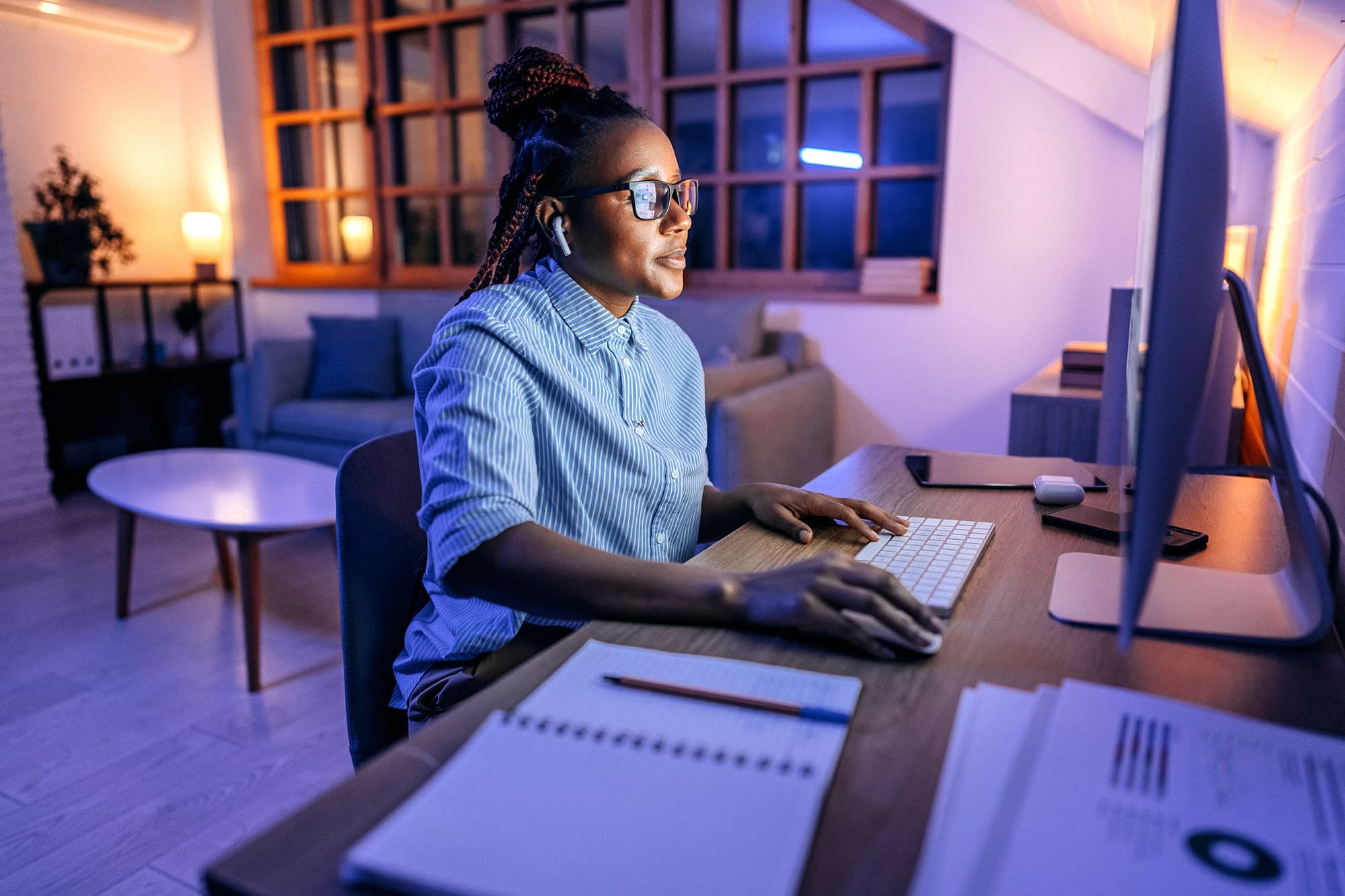 A GMG EnviroSafe team member working remotely at a laptop